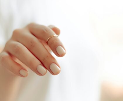 Hands with a clean white manicure