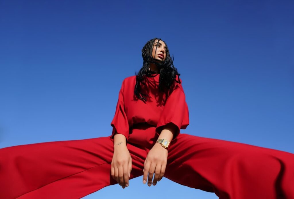 Fashion editorial portrait in a bold red outfit