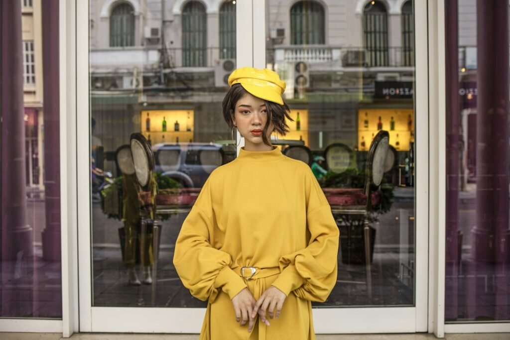 Woman standing near a fashion store window