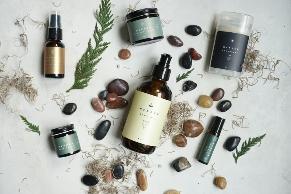 Skincare products with stones and botanical accents