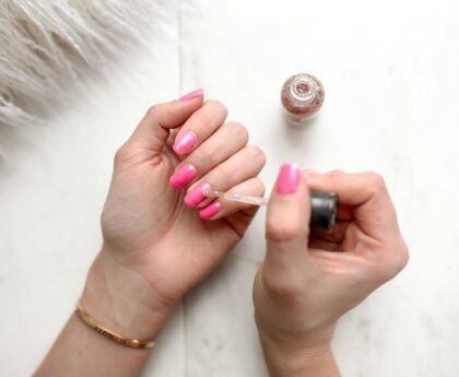 Nail polish being applied during a manicure