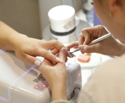 Professional nail salon manicure in progress